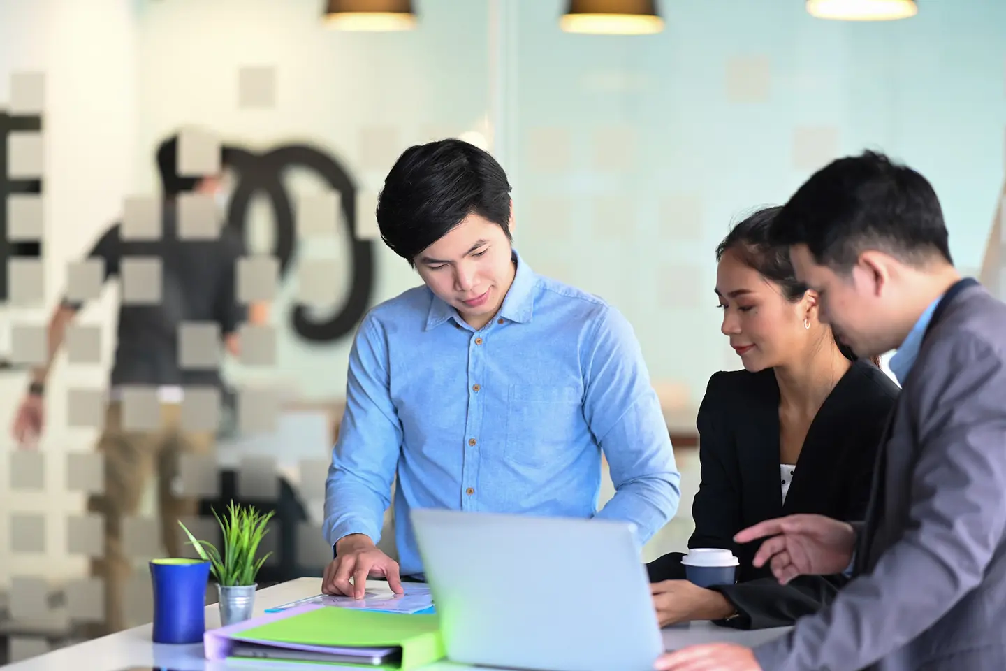 Corporate business team making great business discussion in modern co working office